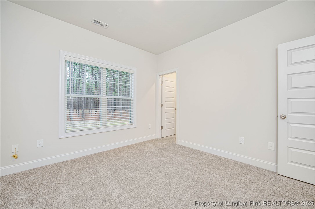 1105 Wolf Pne Court Fayetteville, NC 28311 - Photo 16 of 36 a view of an empty room with a window