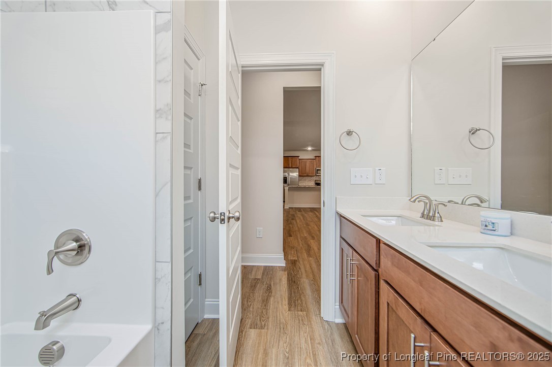 1105 Wolf Pne Court Fayetteville, NC 28311 - Photo 18 of 36 a bathroom with a sink a toilet and shower