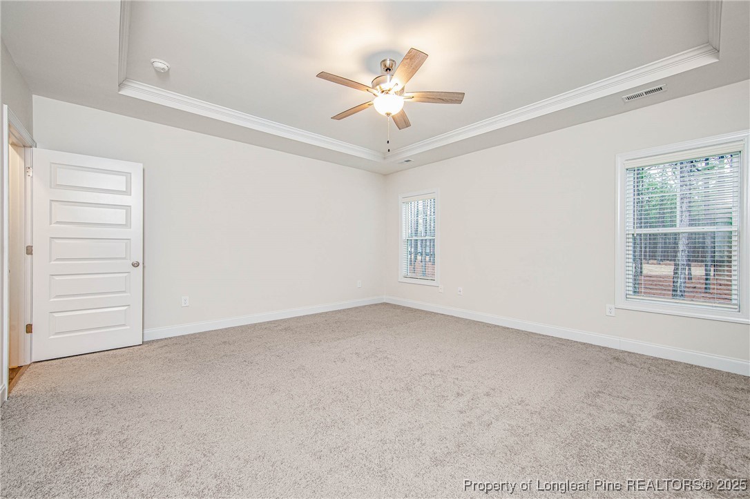 1105 Wolf Pne Court Fayetteville, NC 28311 - Photo 20 of 36 an empty room with a ceiling fan and a window