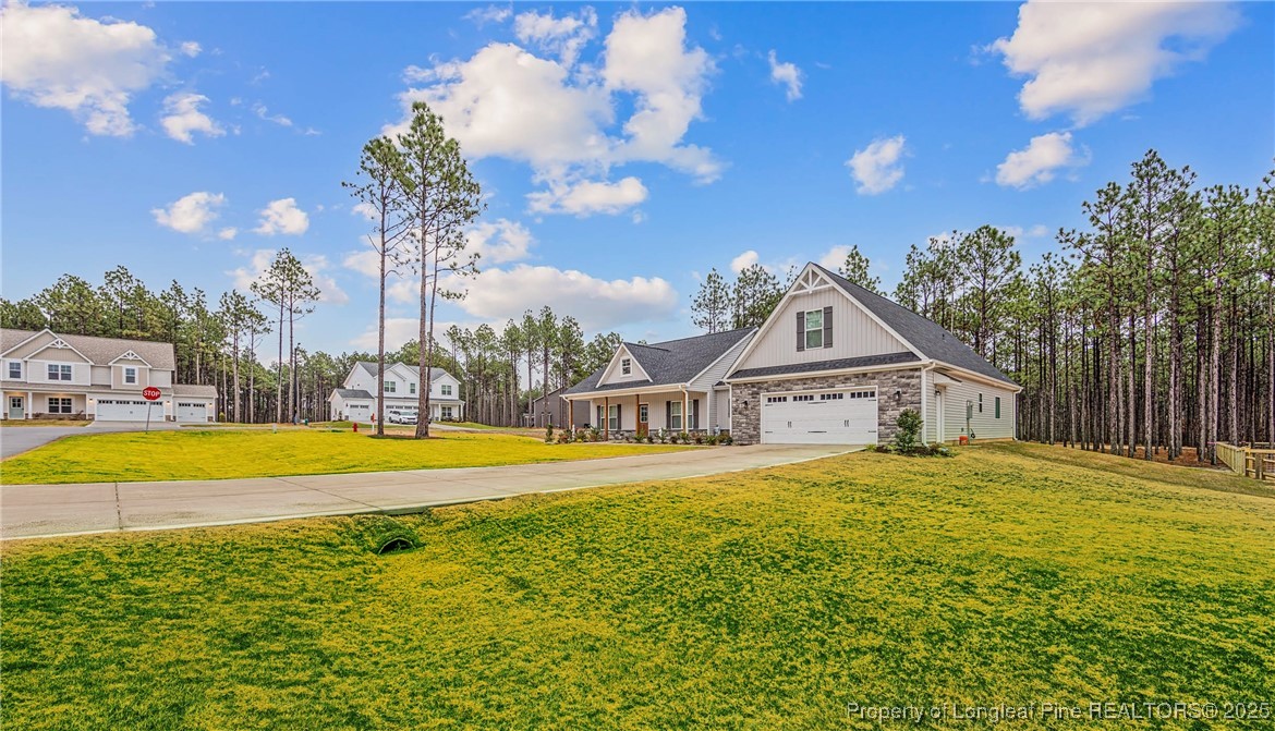 1105 Wolf Pne Court Fayetteville, NC 28311 - Photo 2 of 36 a view of a house with pool and a yard with green space