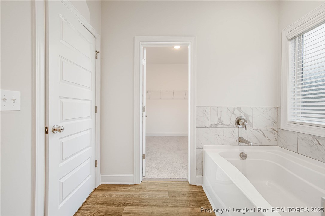 1105 Wolf Pne Court Fayetteville, NC 28311 - Photo 25 of 36 a bathroom with a tub shower and two sink