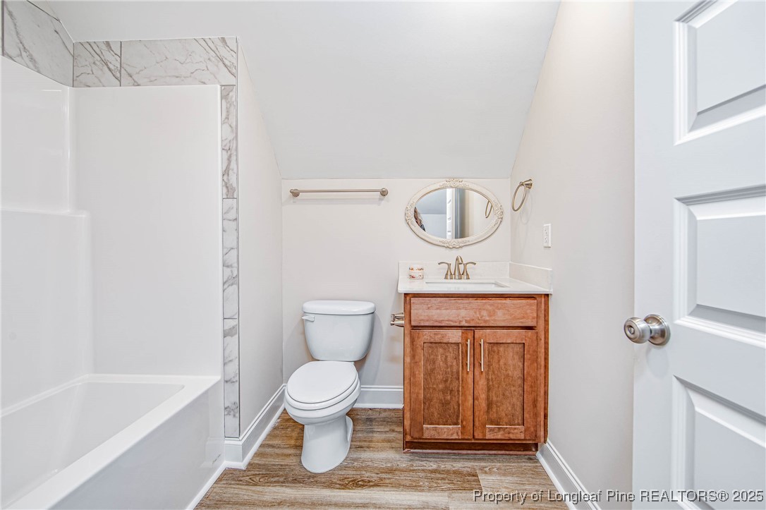 1105 Wolf Pne Court Fayetteville, NC 28311 - Photo 31 of 36 a bathroom with a toilet a sink and bathtub