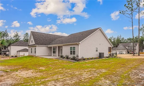 a view of a swimming pool with a yard
