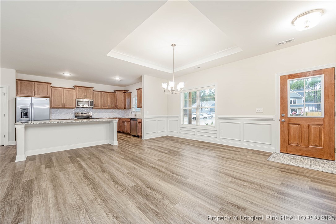 1105 Wolf Pne Court Fayetteville, NC 28311 - Photo 5 of 36 a view of kitchen with wooden floor and window