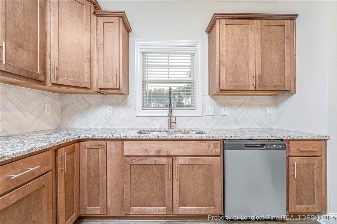 1105 Wolf Pne Court Fayetteville, NC 28311 - Photo 9 of 36 a kitchen with granite countertop cabinets and window