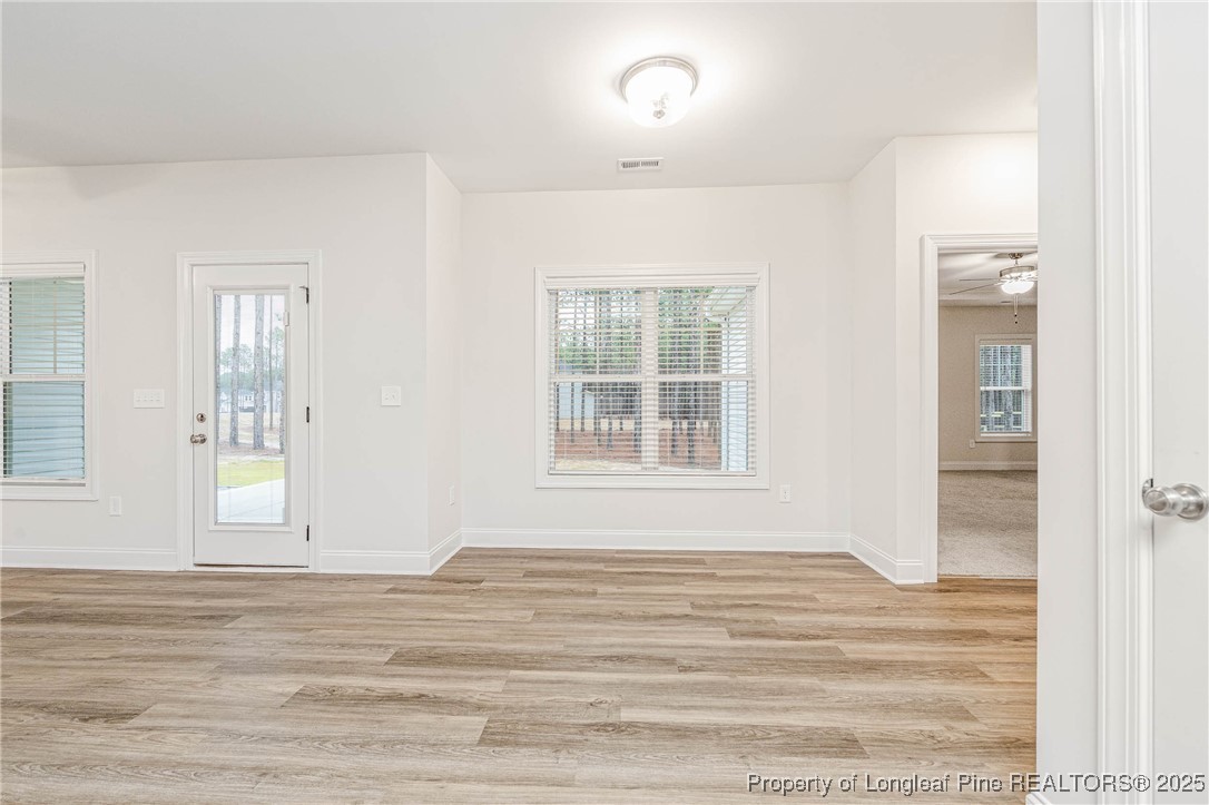 1105 Wolf Pne Court Fayetteville, NC 28311 - Photo 10 of 36 a view of a room with wooden floor and windows