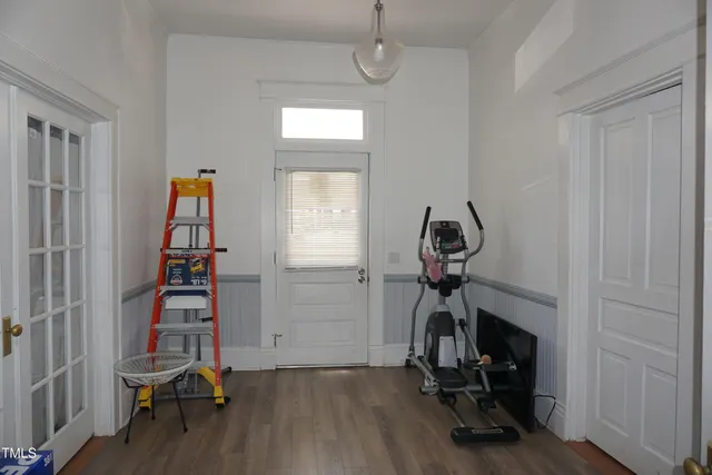 a view of a house with a yard and tree s