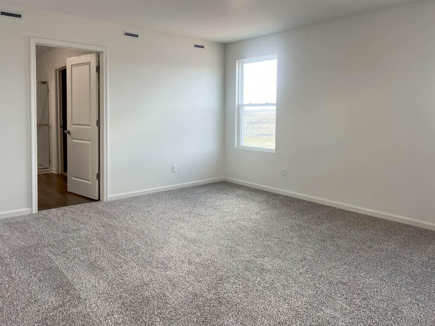 7136 Fair Oaks Road Mount Pleasant, WI 53403 - Photo 4 of 26 Upstairs Primary bedroom with connecting en suite