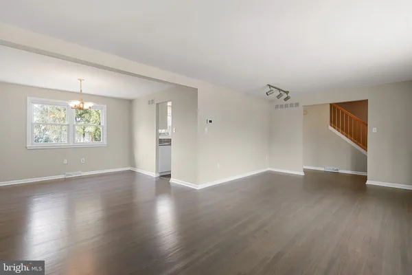 a bathroom with a sink mirror toilet and shower
