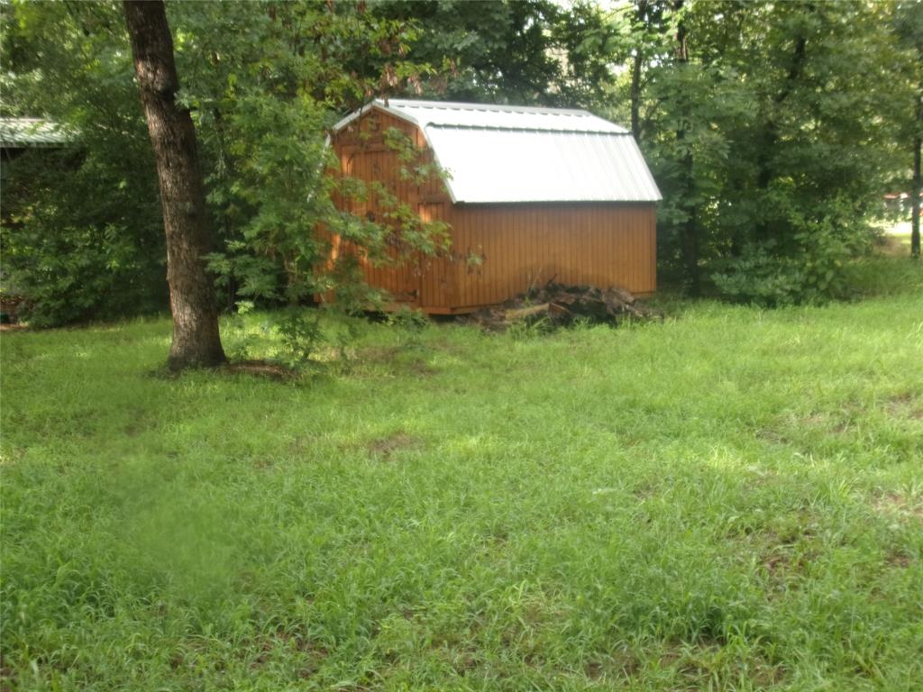 187 Holly Lane Murchison, TX 75778 - Photo 5 of 19 View of yard featuring an outdoor structure