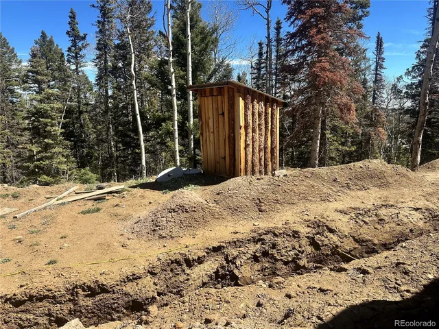 a view of a backyard of the house