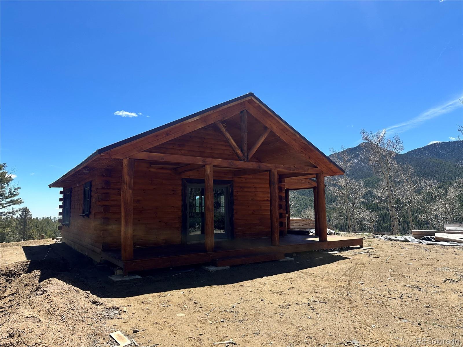 3425 Co Road Westcliffe, CO 81252 - Photo 5 of 15 a view of a house with a yard