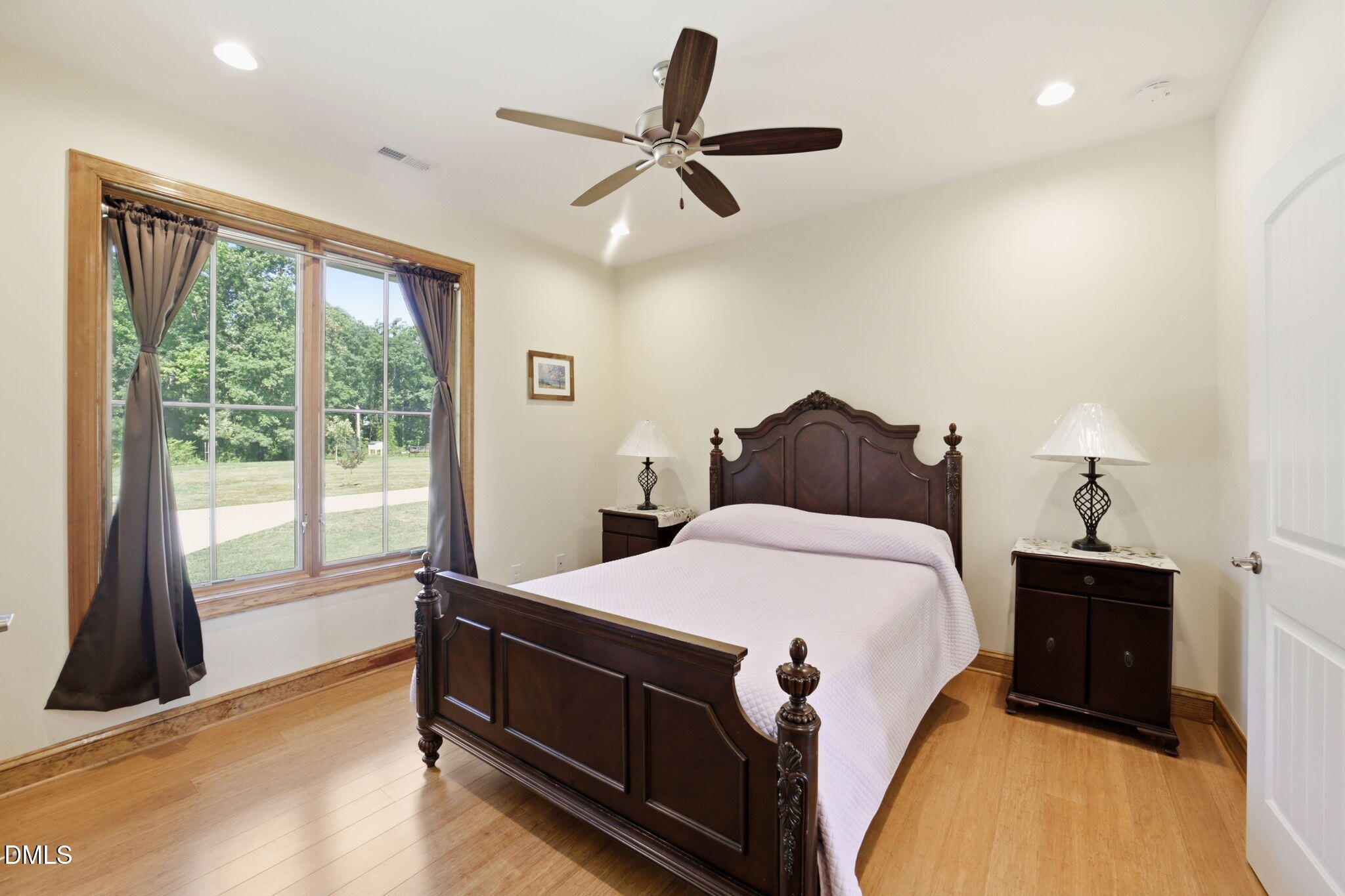 35 North Rippling Court Smithfield, NC 27577 - Photo 32 of 59 a bedroom with a bed and a large window
