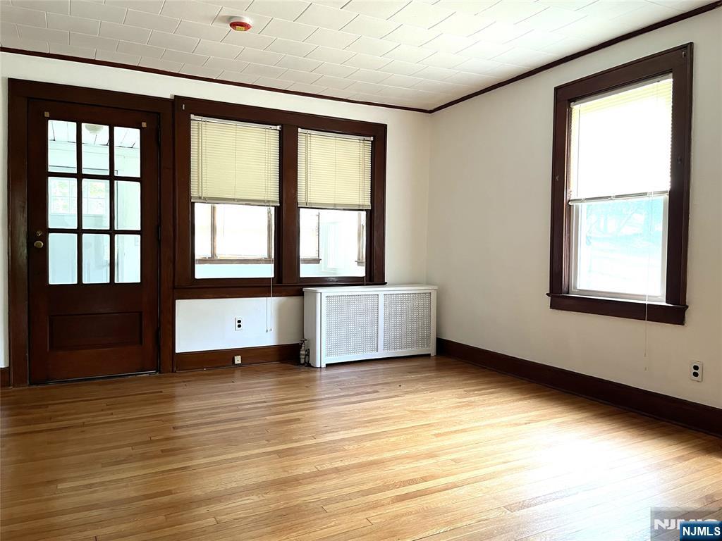 1156 High Mountain Road North Haledon, NJ 07508 - Photo 4 of 14 a view of an empty room with a window and wooden floor