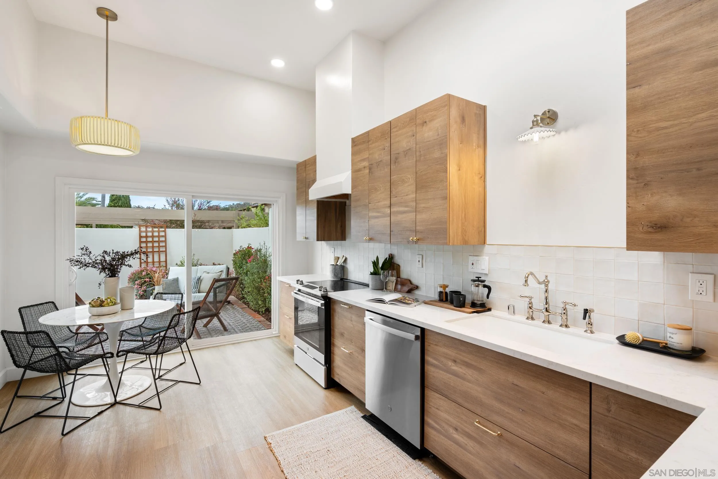 103 Cancha De Golf Rancho Santa Fe, CA 92091 - Photo 11 of 32 a kitchen with a sink cabinets and window