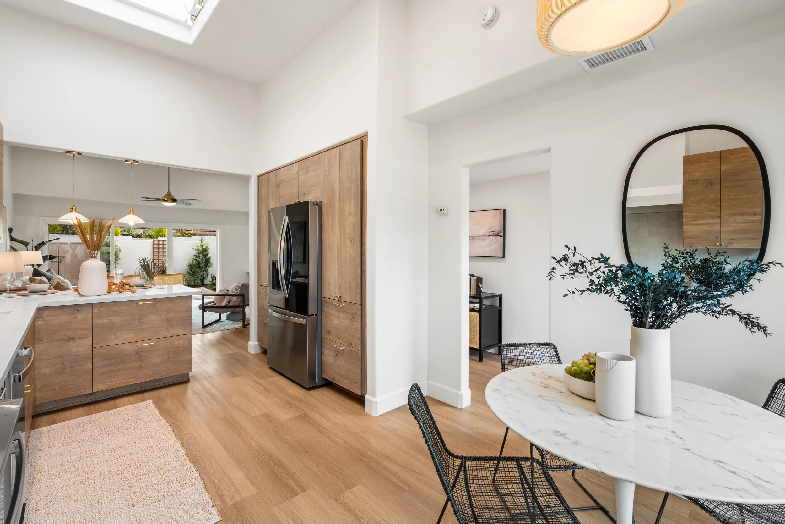 103 Cancha De Golf Rancho Santa Fe, CA 92091 - Photo 12 of 32 a dining room with furniture and potted plants