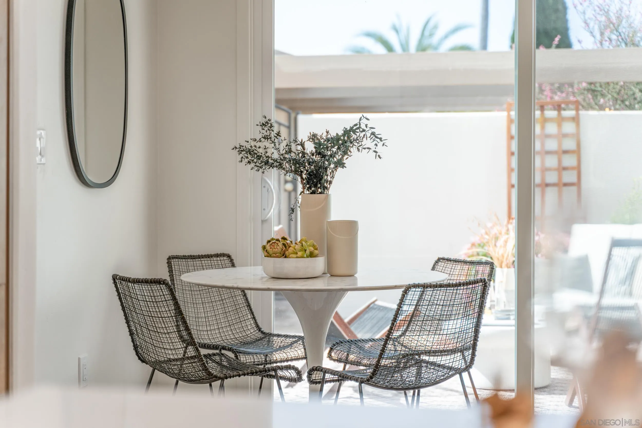 103 Cancha De Golf Rancho Santa Fe, CA 92091 - Photo 13 of 32 a view of a dining room with furniture and a potted plant