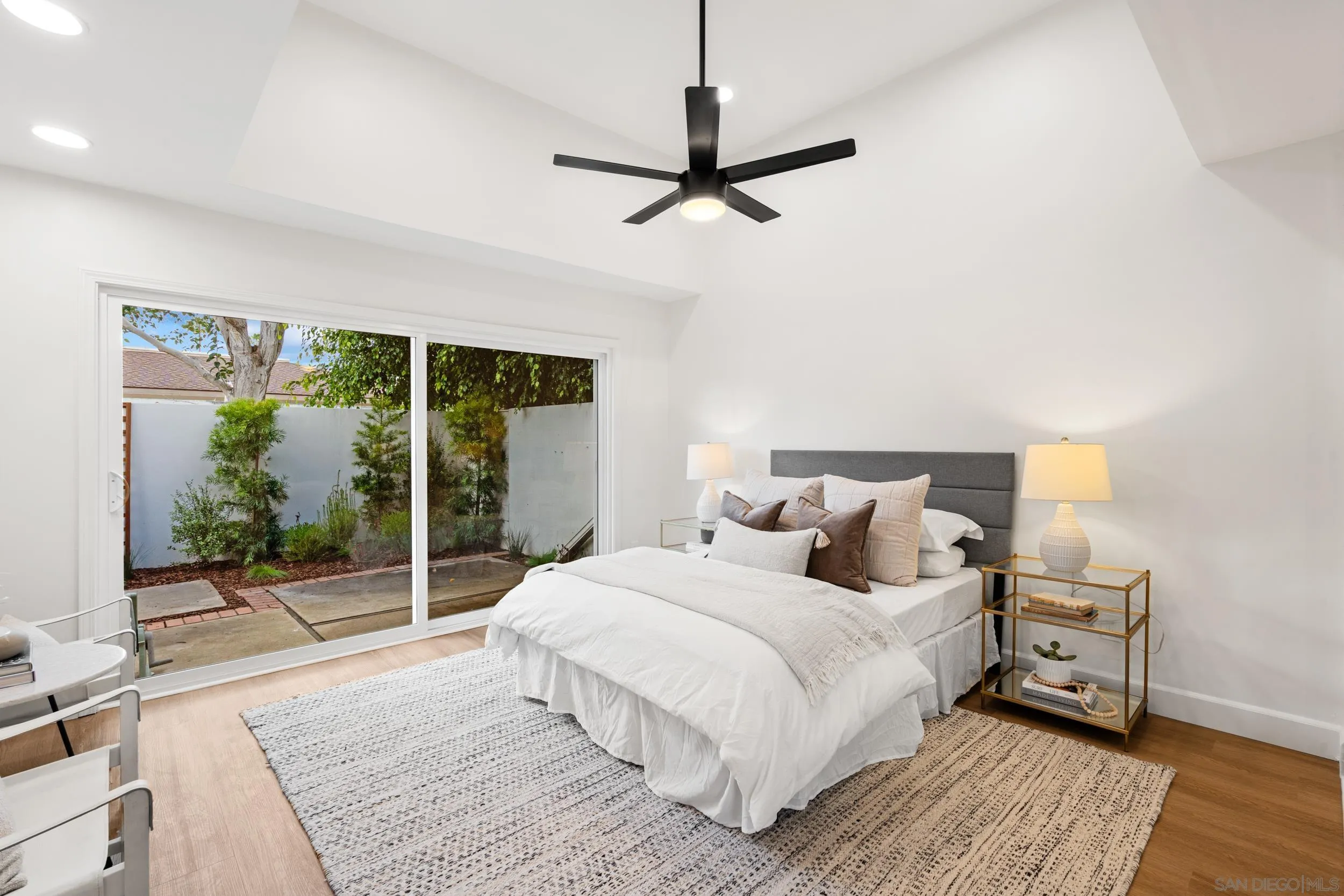 103 Cancha De Golf Rancho Santa Fe, CA 92091 - Photo 14 of 32 a bedroom with a bed and a large window