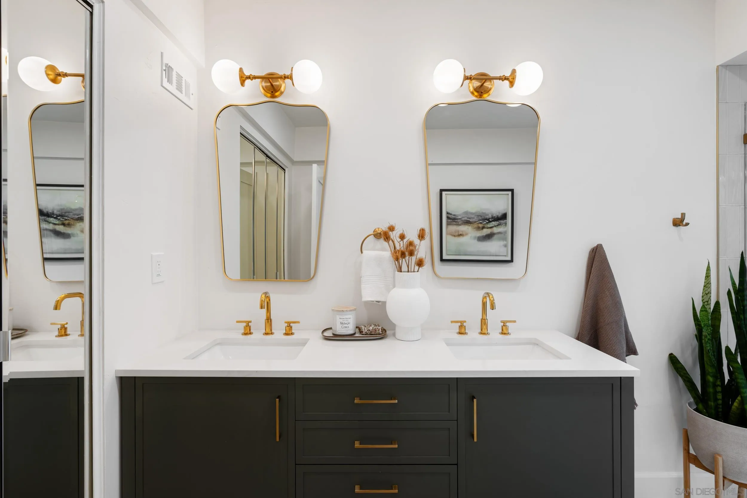 103 Cancha De Golf Rancho Santa Fe, CA 92091 - Photo 16 of 32 a bathroom with a sink and a mirror