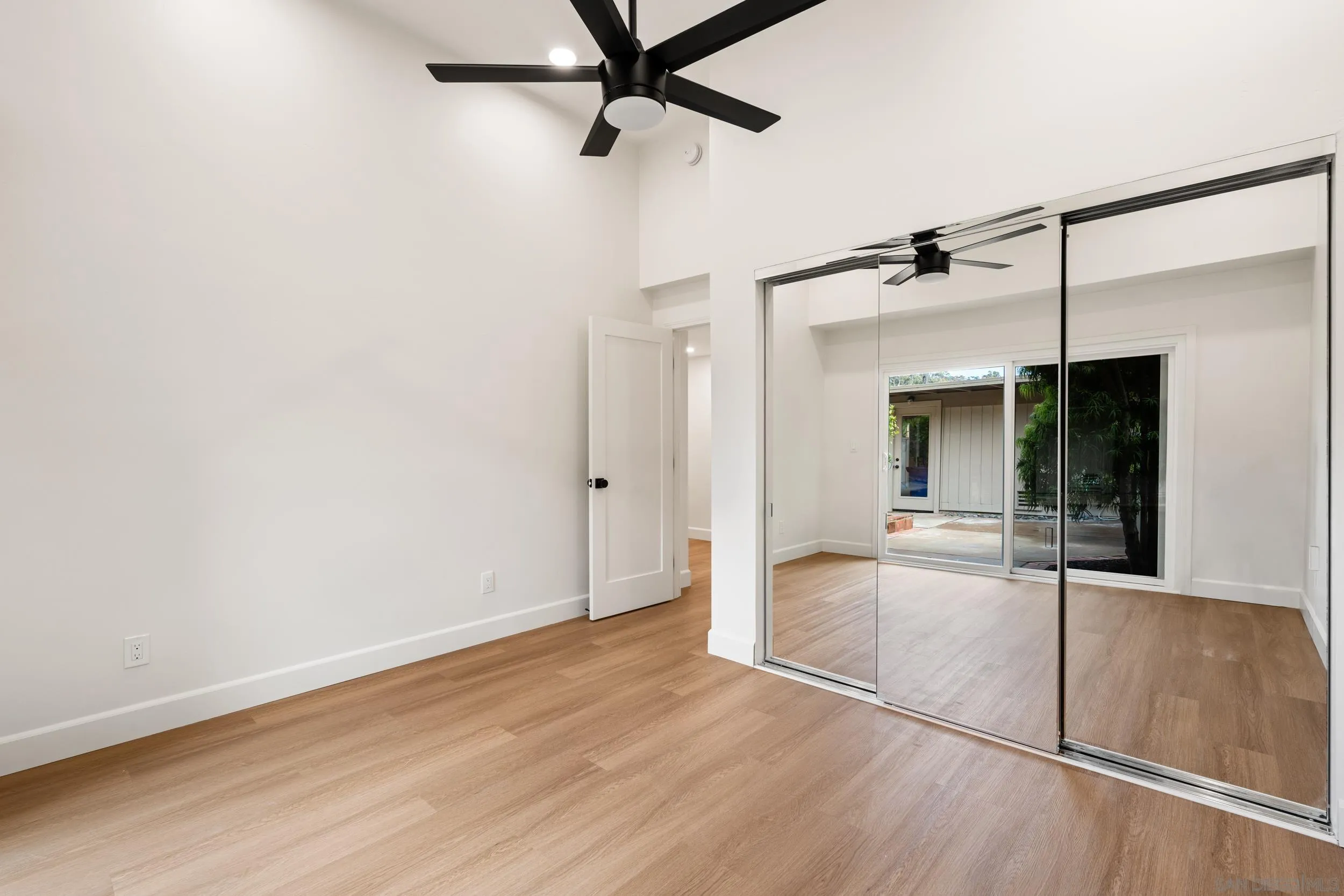 103 Cancha De Golf Rancho Santa Fe, CA 92091 - Photo 20 of 32 en empty room with wooden floor and a ceiling fan