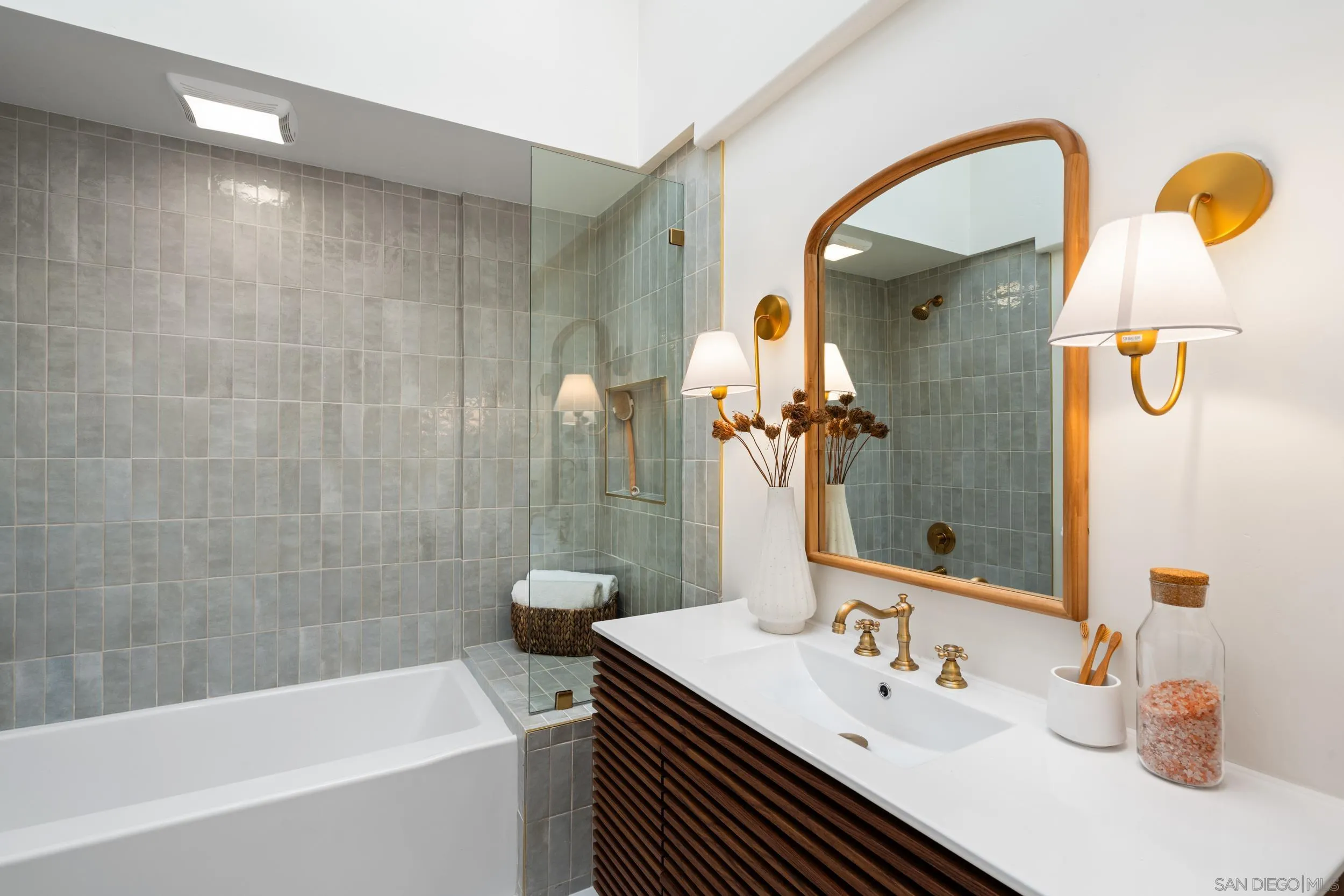 103 Cancha De Golf Rancho Santa Fe, CA 92091 - Photo 21 of 32 a bathroom with a sink and a mirror