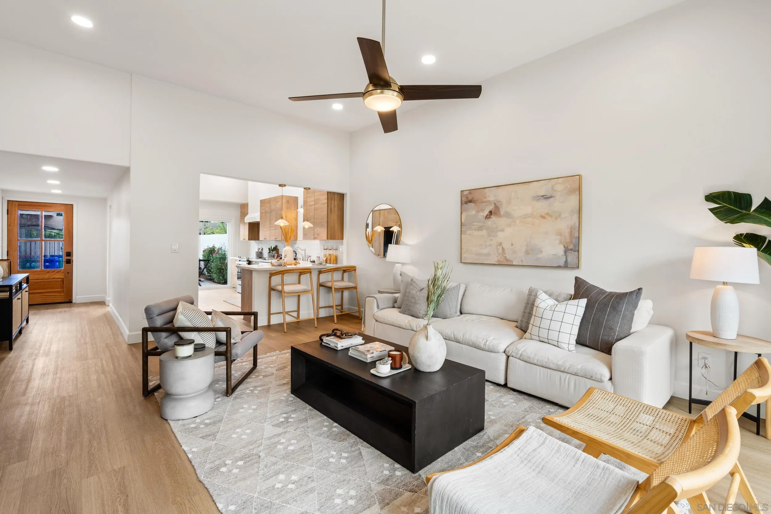 103 Cancha De Golf Rancho Santa Fe, CA 92091 - Photo 4 of 32 a living room with furniture and a large window