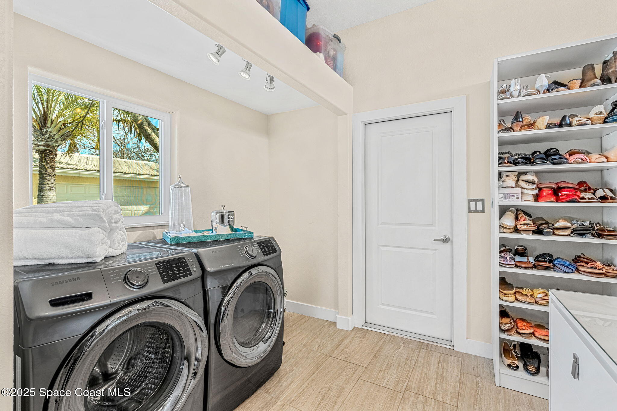 561 Capri Road Cocoa Beach, FL 32931 - Photo 12 of 82 a utility room with dryer and washer