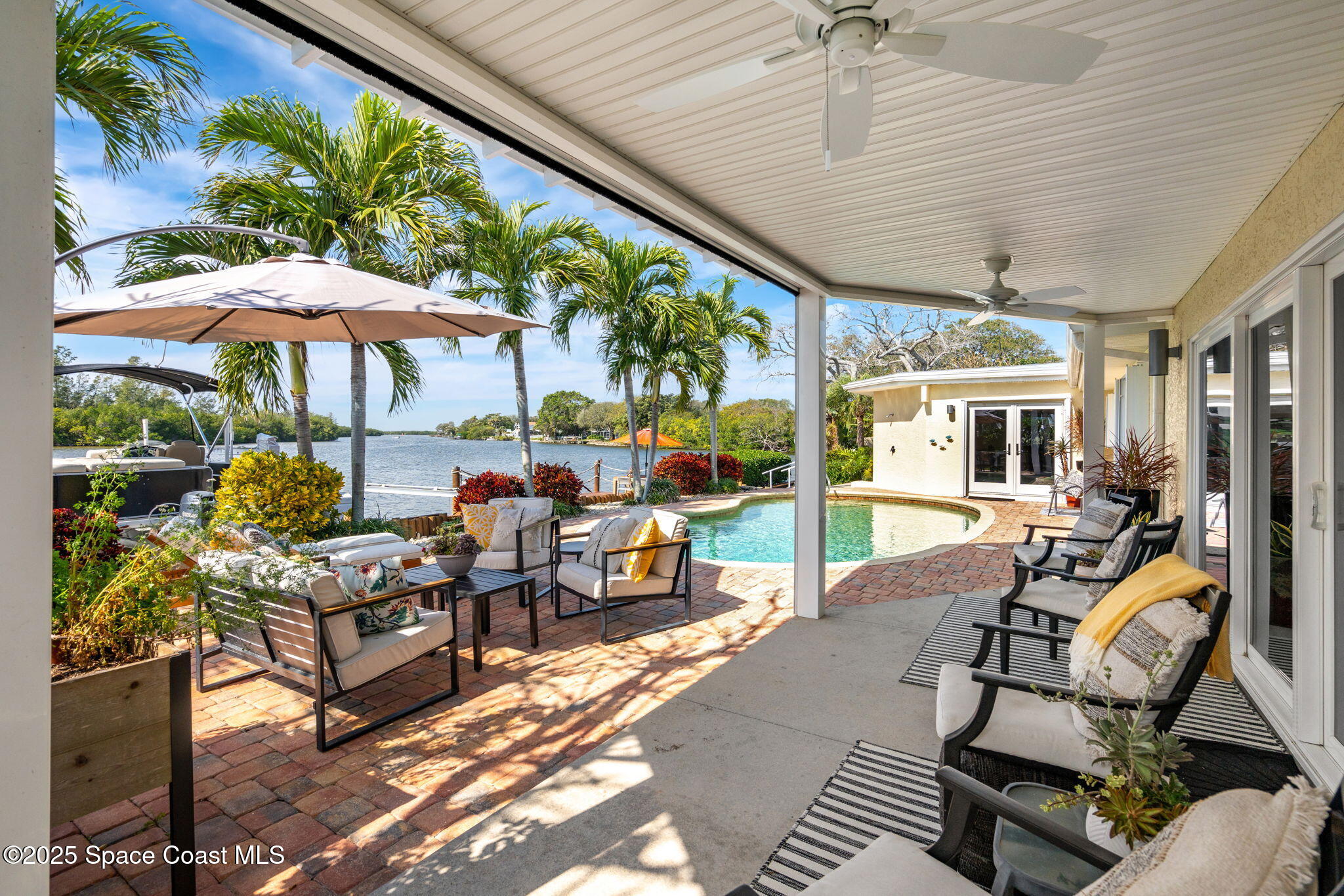 561 Capri Road Cocoa Beach, FL 32931 - Photo 13 of 82 a living room filled with furniture