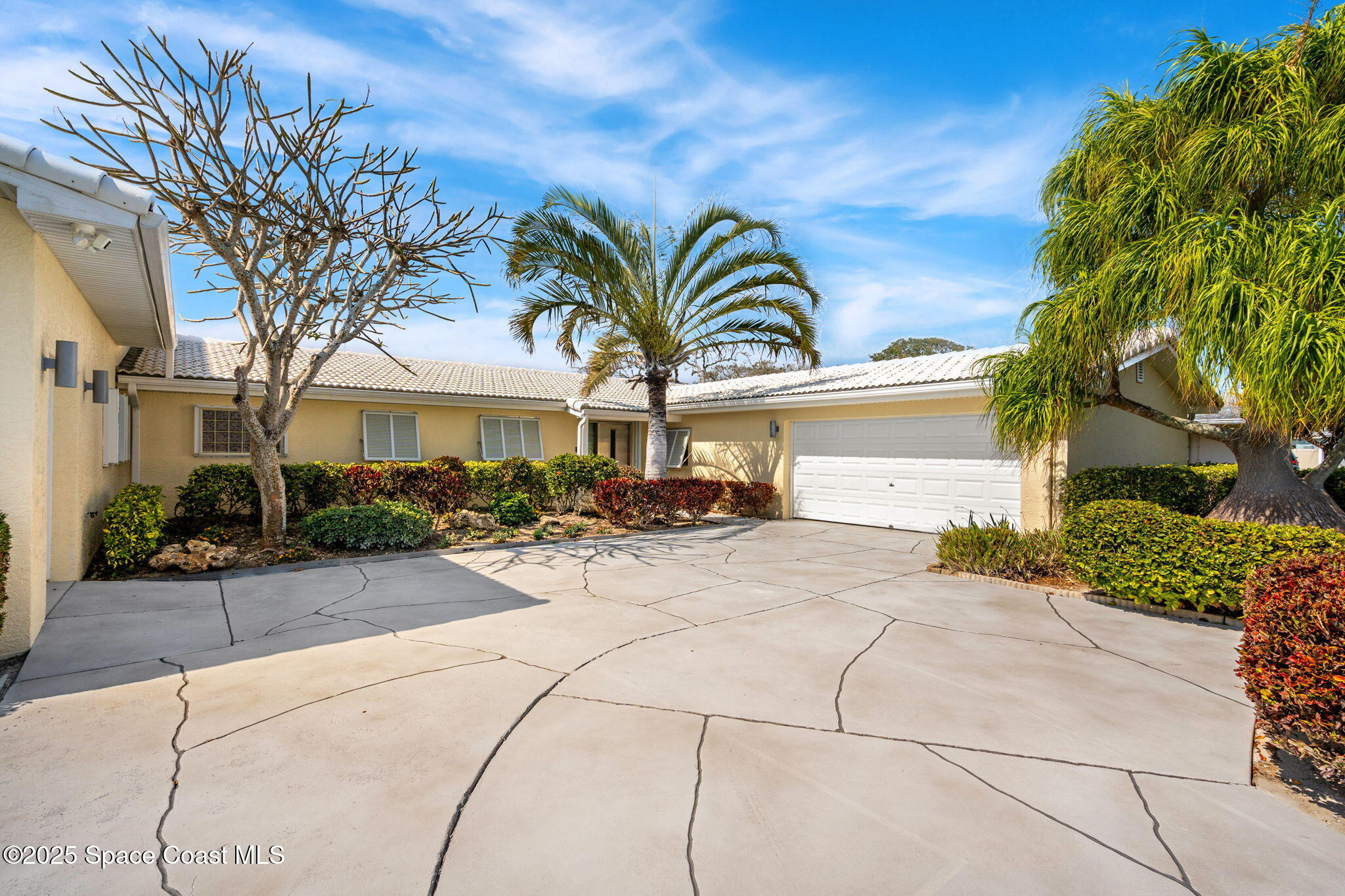 561 Capri Road Cocoa Beach, FL 32931 - Photo 21 of 82 a view of a house with a patio