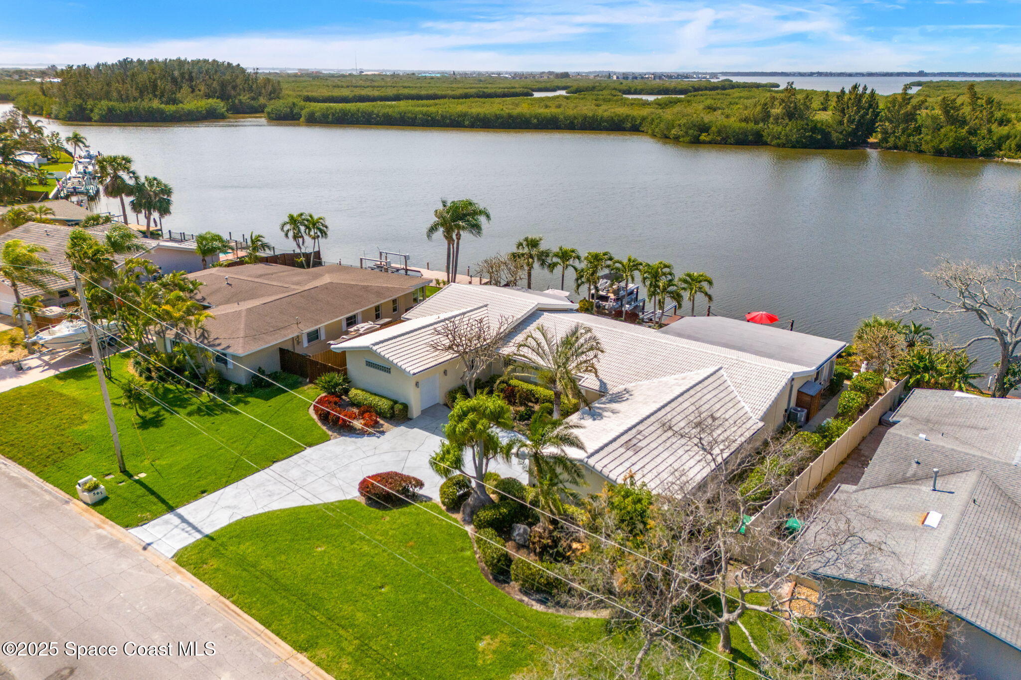 561 Capri Road Cocoa Beach, FL 32931 - Photo 70 of 82 an aerial view of a house with a lake view