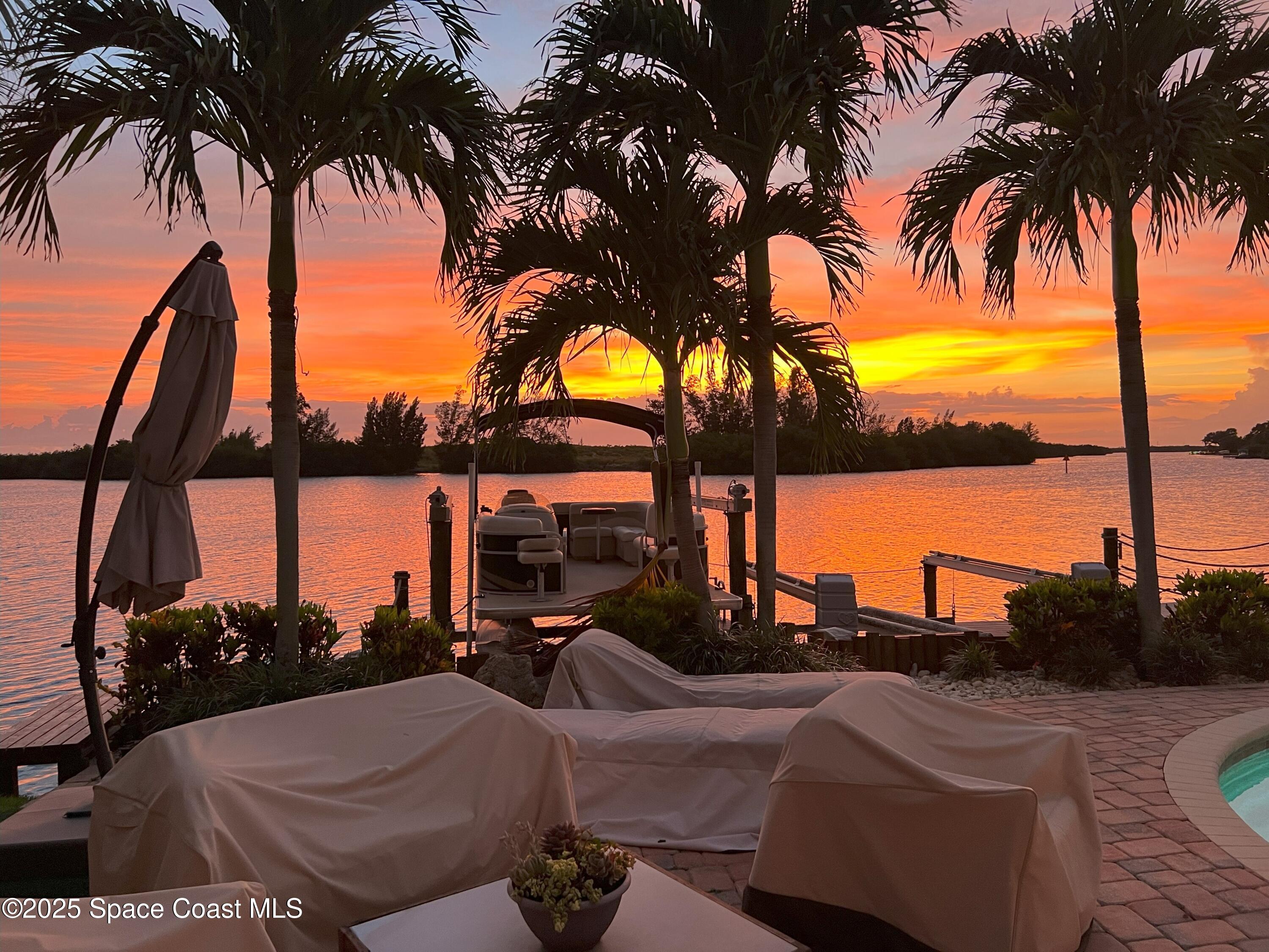 561 Capri Road Cocoa Beach, FL 32931 - Photo 79 of 82 a view of a patio with swimming pool