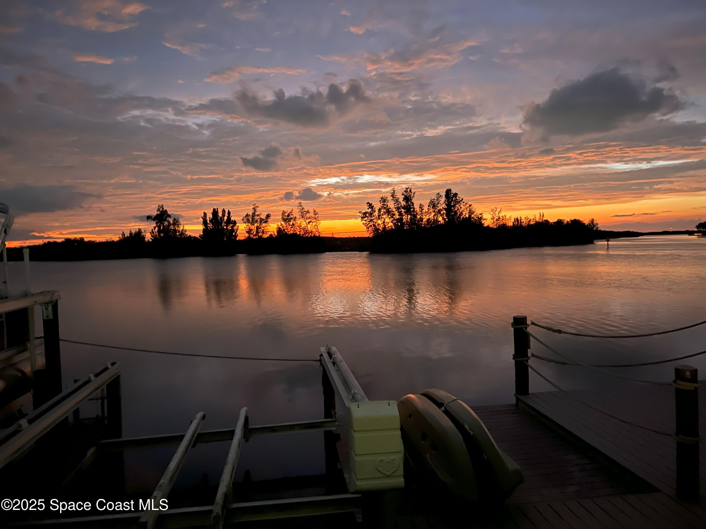 561 Capri Road Cocoa Beach, FL 32931 - Photo 80 of 82 a view of a lake with outdoor seating