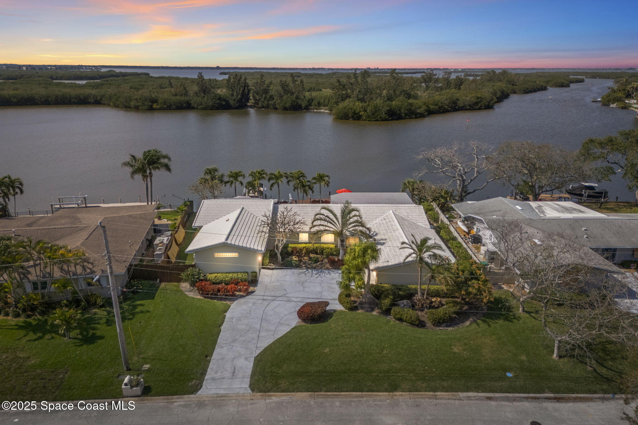 561 Capri Road Cocoa Beach, FL 32931 - Photo 81 of 82 an aerial view of a house with lake view and mountain view