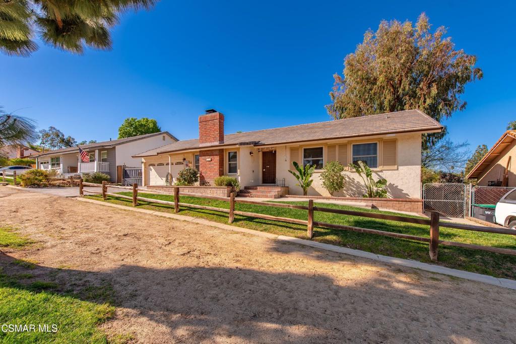 683 Languid Lane Simi Valley, CA 93065 - Photo 1 of 27 a front view of a house with a yard
