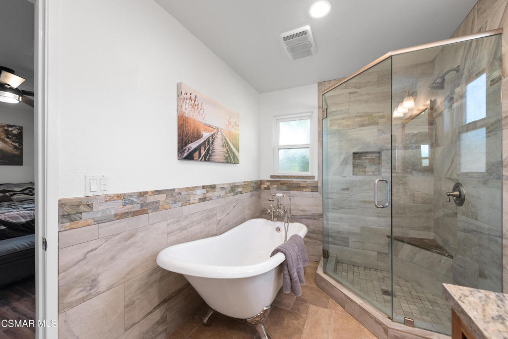 683 Languid Lane Simi Valley, CA 93065 - Photo 13 of 27 a spacious bathroom with a bathtub and shower