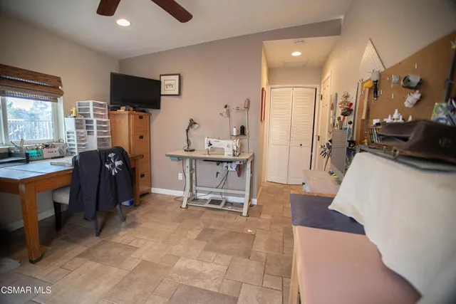 a living room with furniture flat screen tv and outdoor view