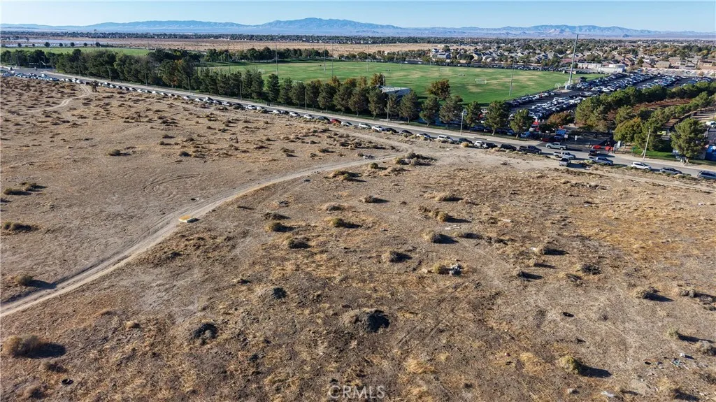 0 Vac/ave L(drt)/33 Road Palmdale, CA 93552 - Photo 25 of 26 a view of a dry yard with wooden fence