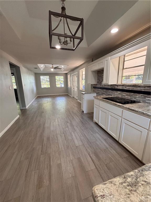 1012 South Inspiration Road Mission, TX 78573 - Photo 1 of 1 a view of a kitchen with sink and wooden floor