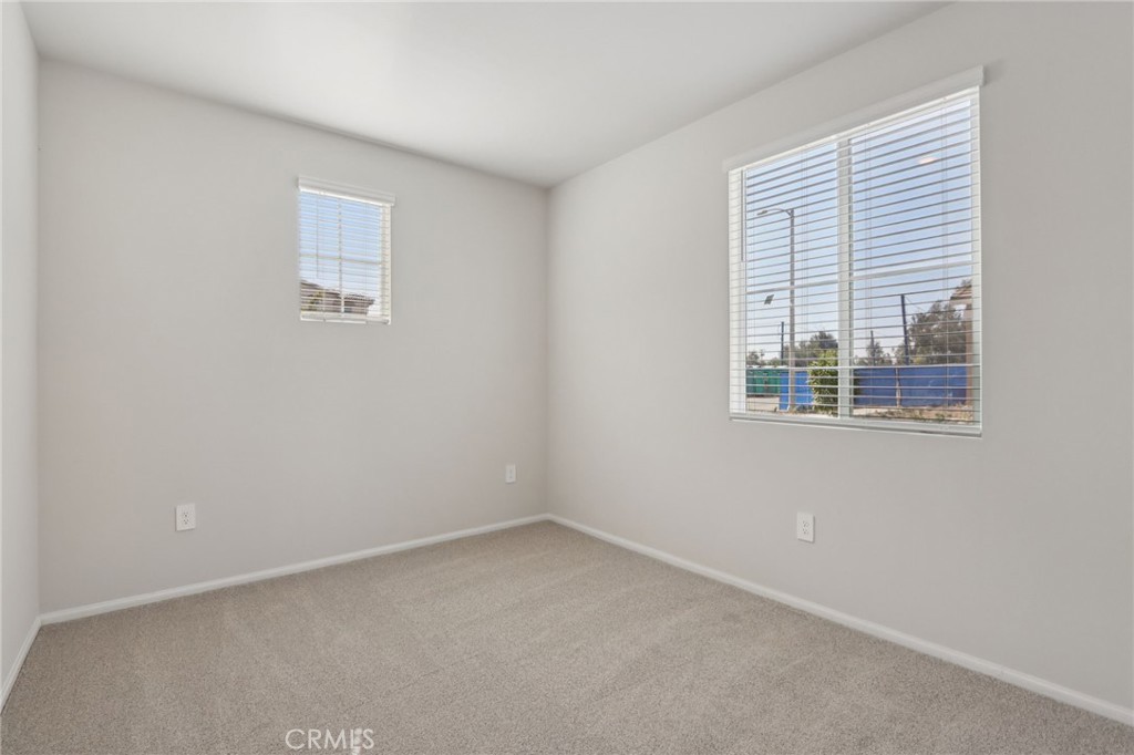 1110 Tropic Court Redlands, CA 92374 - Photo 18 of 44 an empty room with windows