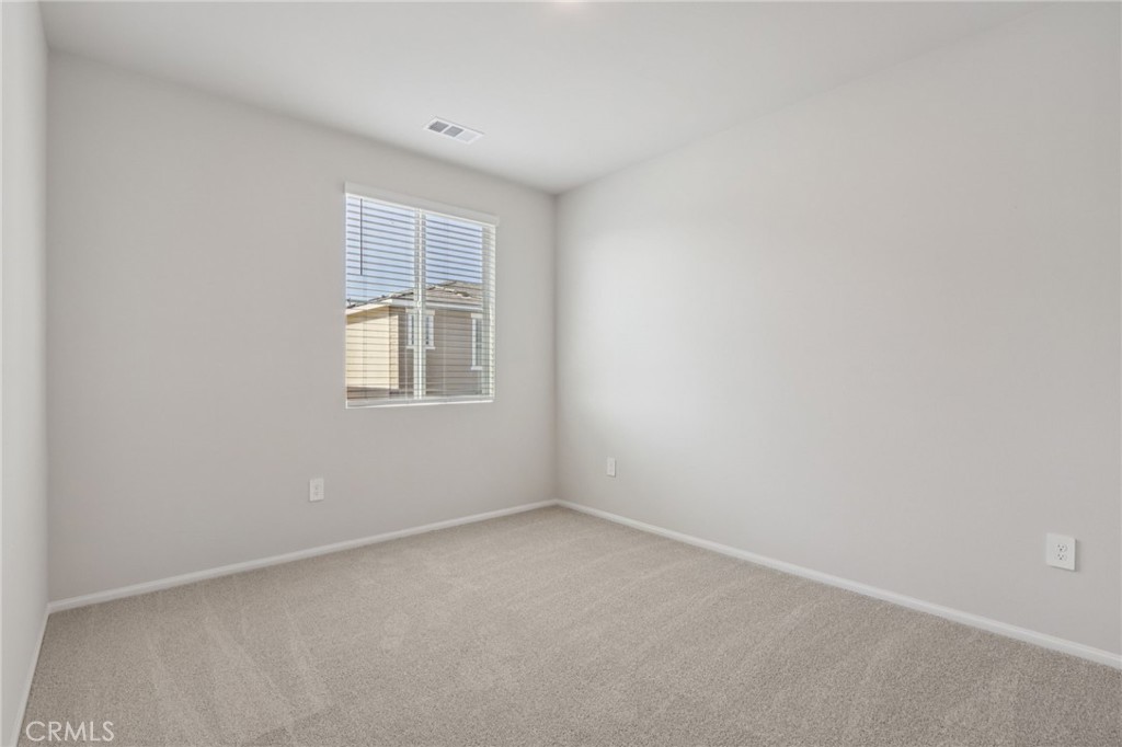 1110 Tropic Court Redlands, CA 92374 - Photo 23 of 44 a view of an empty room with a window