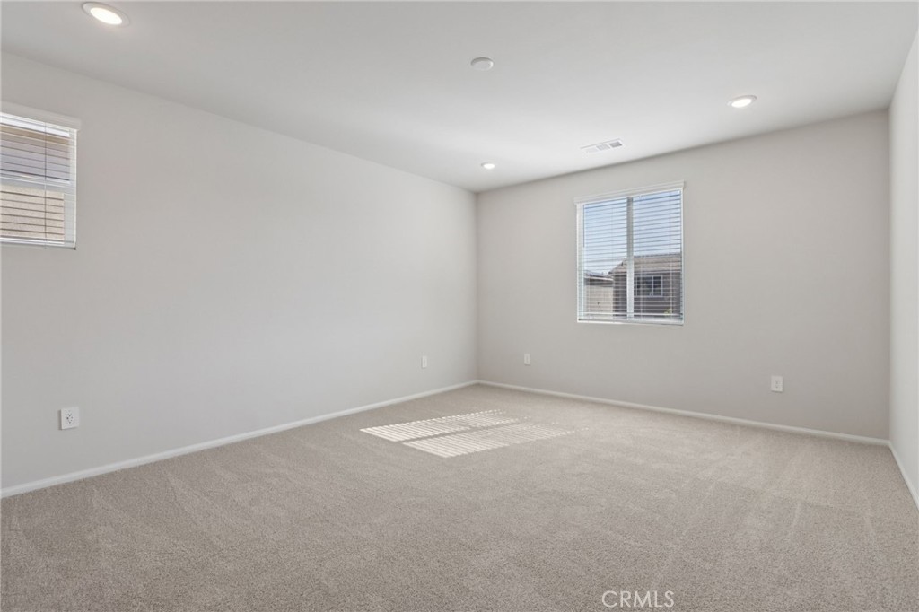 1110 Tropic Court Redlands, CA 92374 - Photo 31 of 44 an empty room with windows