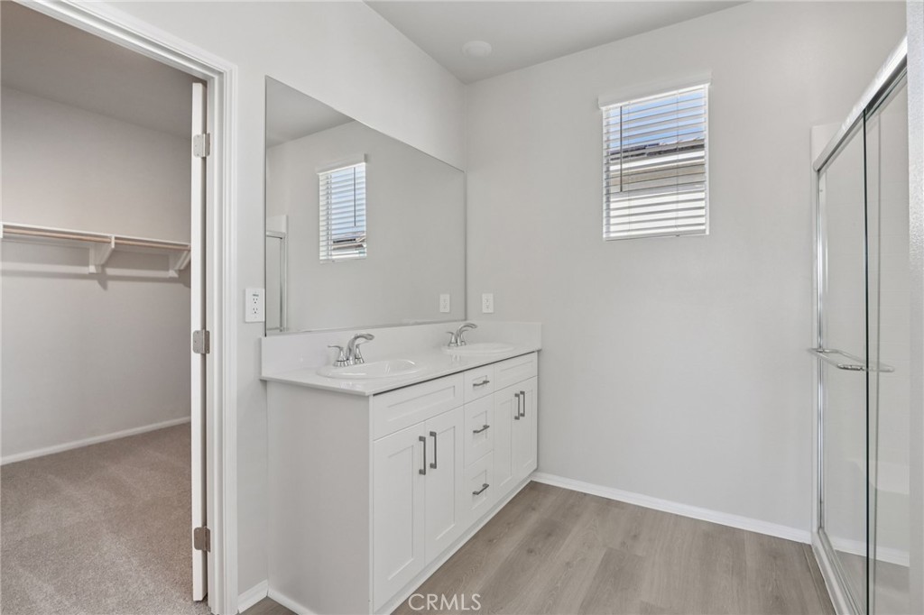 1110 Tropic Court Redlands, CA 92374 - Photo 34 of 44 a bathroom with a granite countertop sink and a mirror