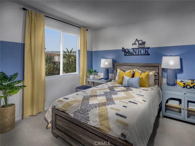 a bedroom with a bed and a potted plant