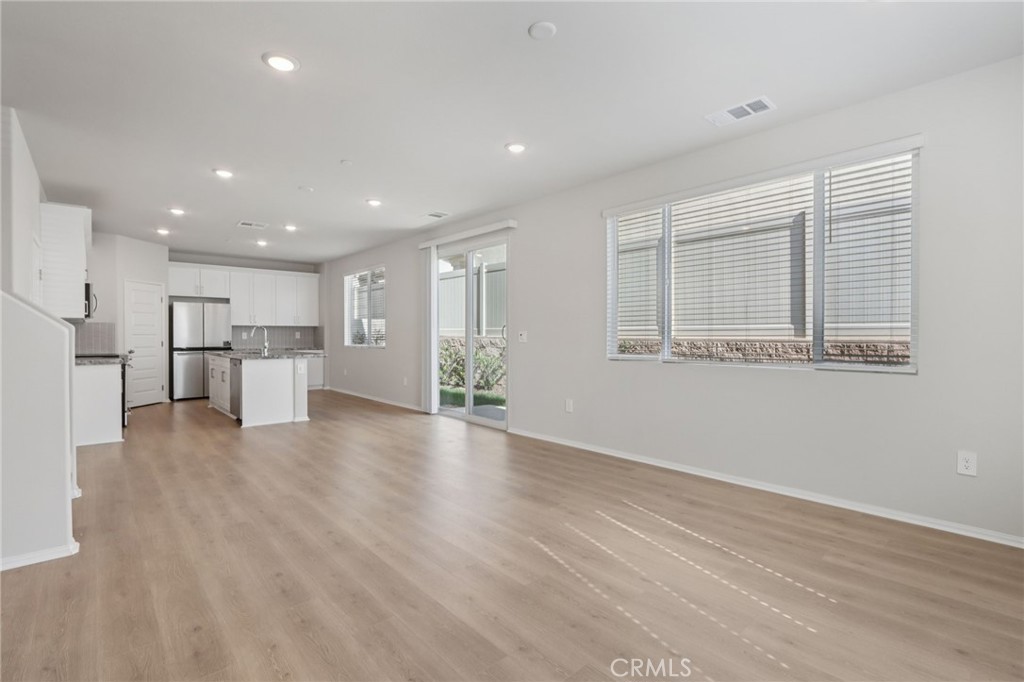 1110 Tropic Court Redlands, CA 92374 - Photo 5 of 44 a view of an empty room with wooden floor