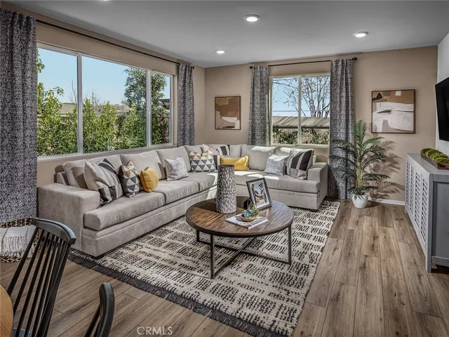a living room with furniture and a large window