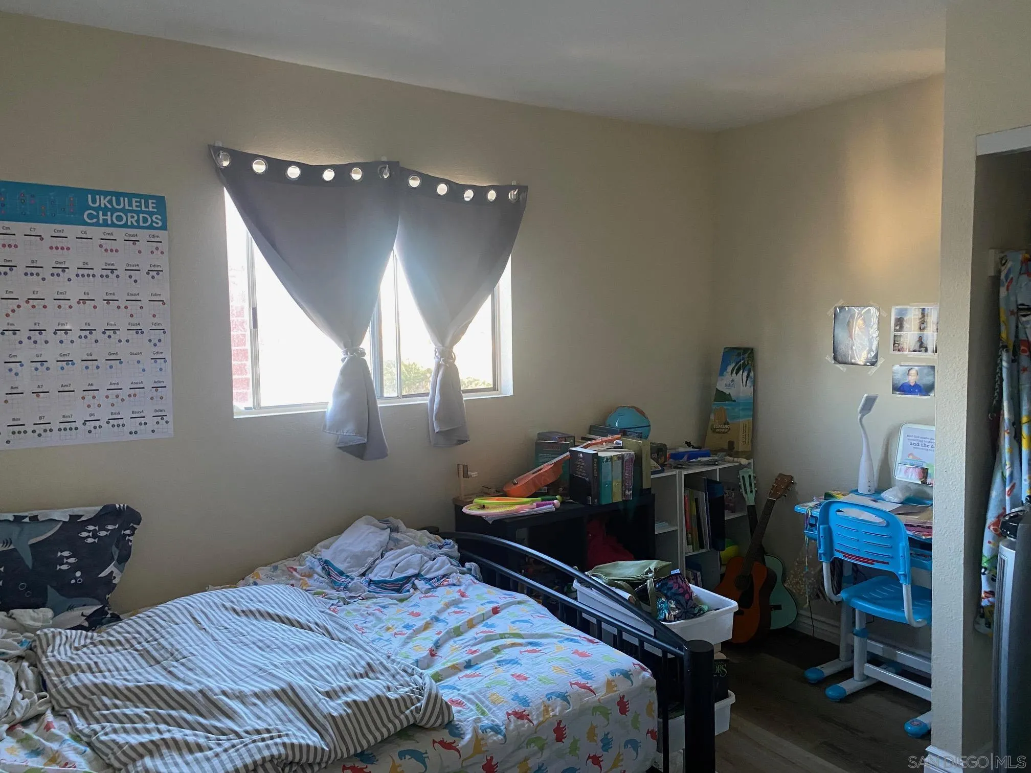 8181 Jade Coast Road San Diego, CA 92126 - Photo 4 of 9 a bedroom with a bed and a window