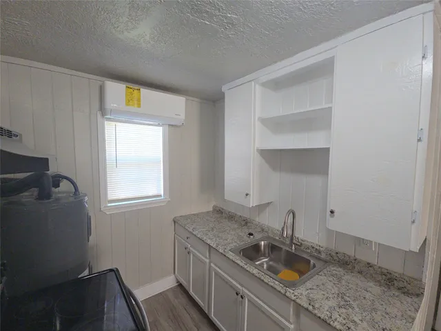 a bathroom with a sink and a window