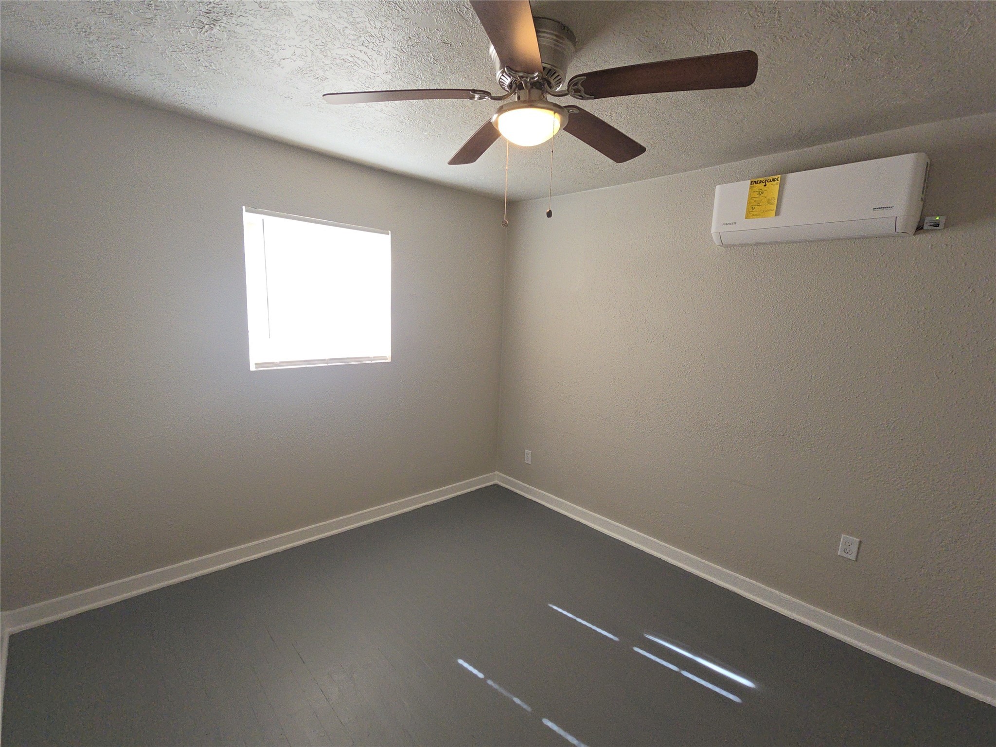 3335 Tuam Street, Unit 2 Houston, TX 77004 - Photo 6 of 15 an empty room with a window and a fan