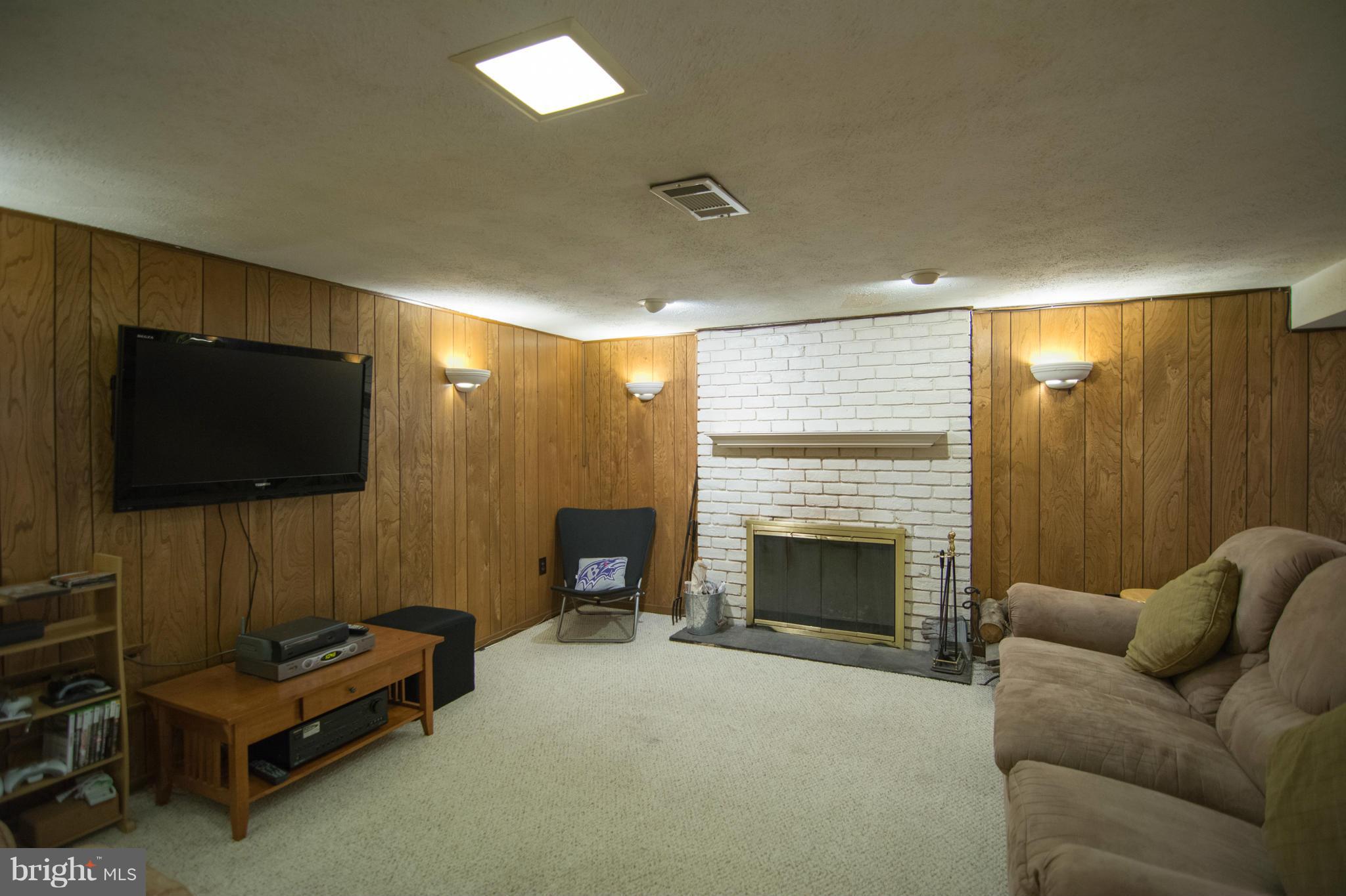 1610 Myamby Road Baltimore, MD 21286 - Photo 14 of 30 a living room with furniture and a flat screen tv