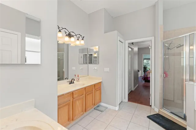 a spacious bathroom with a sink double vanity and a mirror